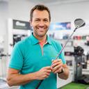 Luis adjusting a golf club during a club fitting session in a bright sports shop