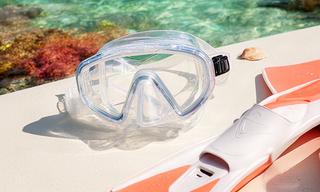 Tidal snorkel set with clear mask and fins prepared for a reef swim