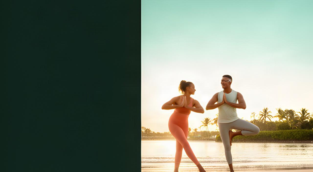 Couple practising yoga on a quiet North Palm Beach beach at sunrise with the Intracoastal shoreline behind them